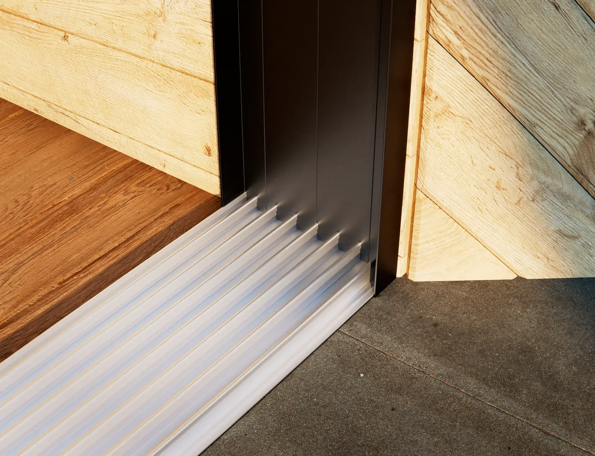 Steellook glazen schuifwand met 7 rails met alleen de rails in beeld en houten muur met planken, net aanzicht.